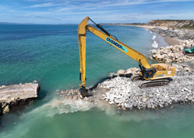 The concrete material is crushed to form the core of the new long groyne