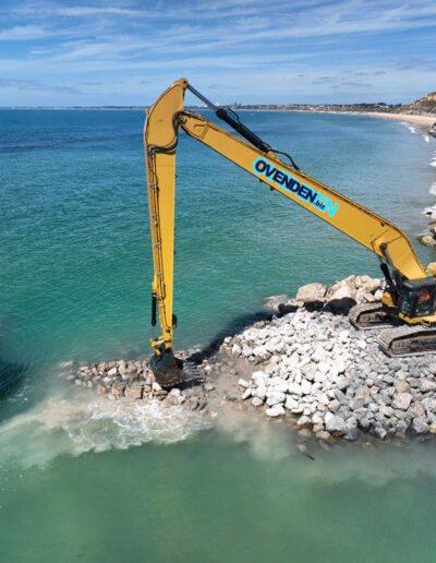 The concrete material is crushed to form the core of the new long groyne